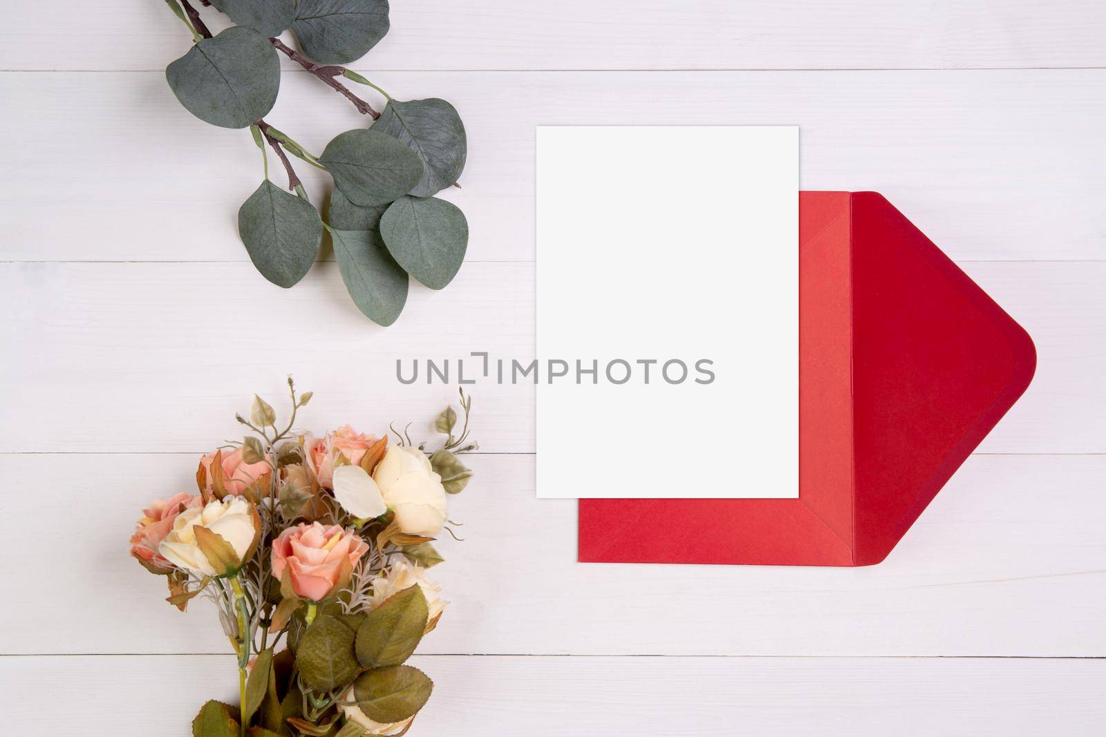 Valentine day, greeting card mockup size a5 and letter and flower on wooden table, postcard blank and letter with romance on desk, present in anniversary and celebration, top view, holiday concept. by nnudoo