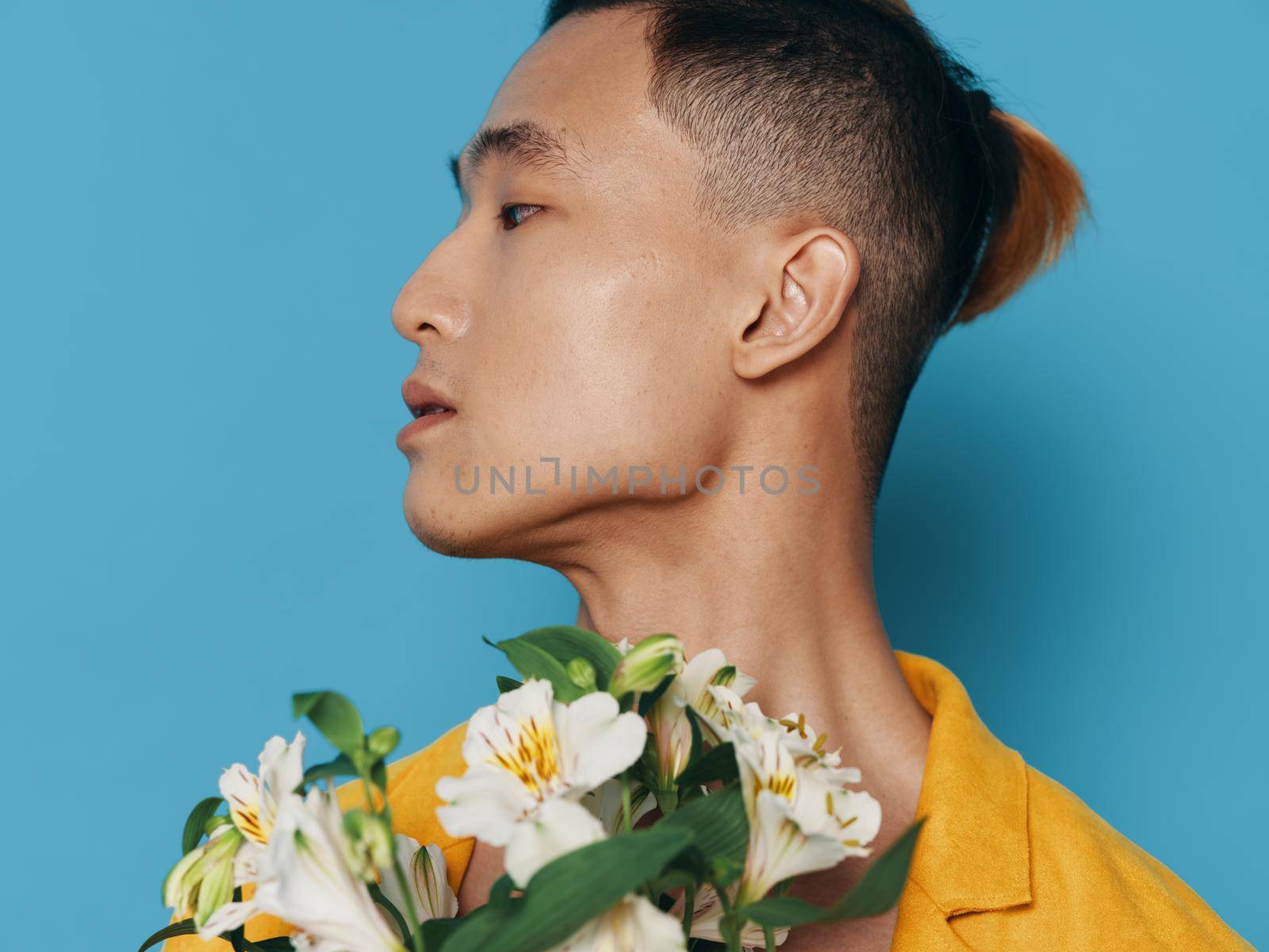 Romantic guy portrait white bouquet flowers hairstyle model. High quality photo