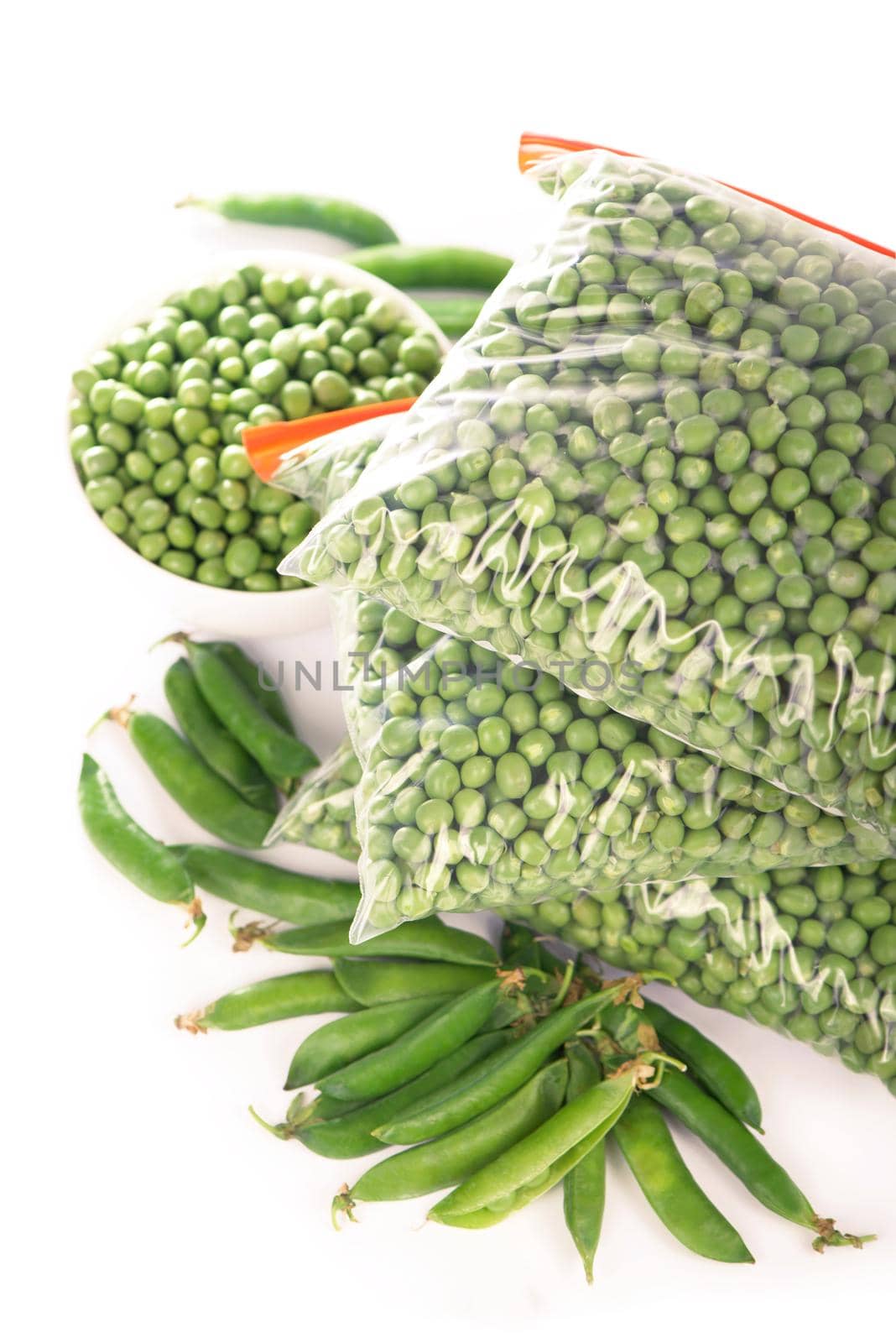 green peas cooked for freezing on a white by aprilphoto