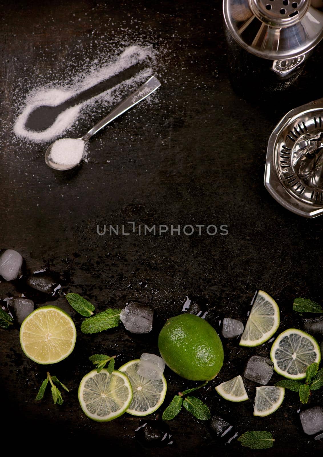 Bar accessories and ingredients for cocktail drink lime, mint, ice.