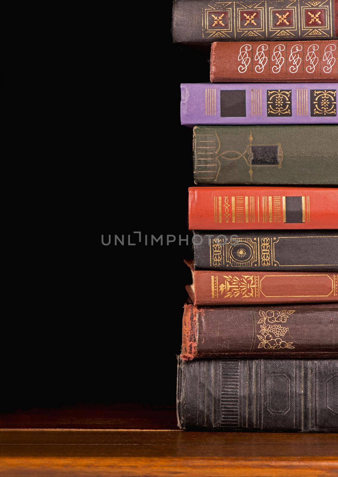 collection old books against a dark background