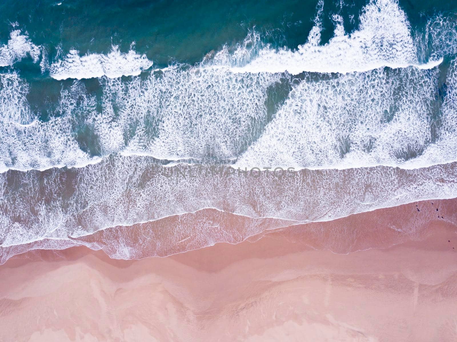 Aerial overhead waves and a beach