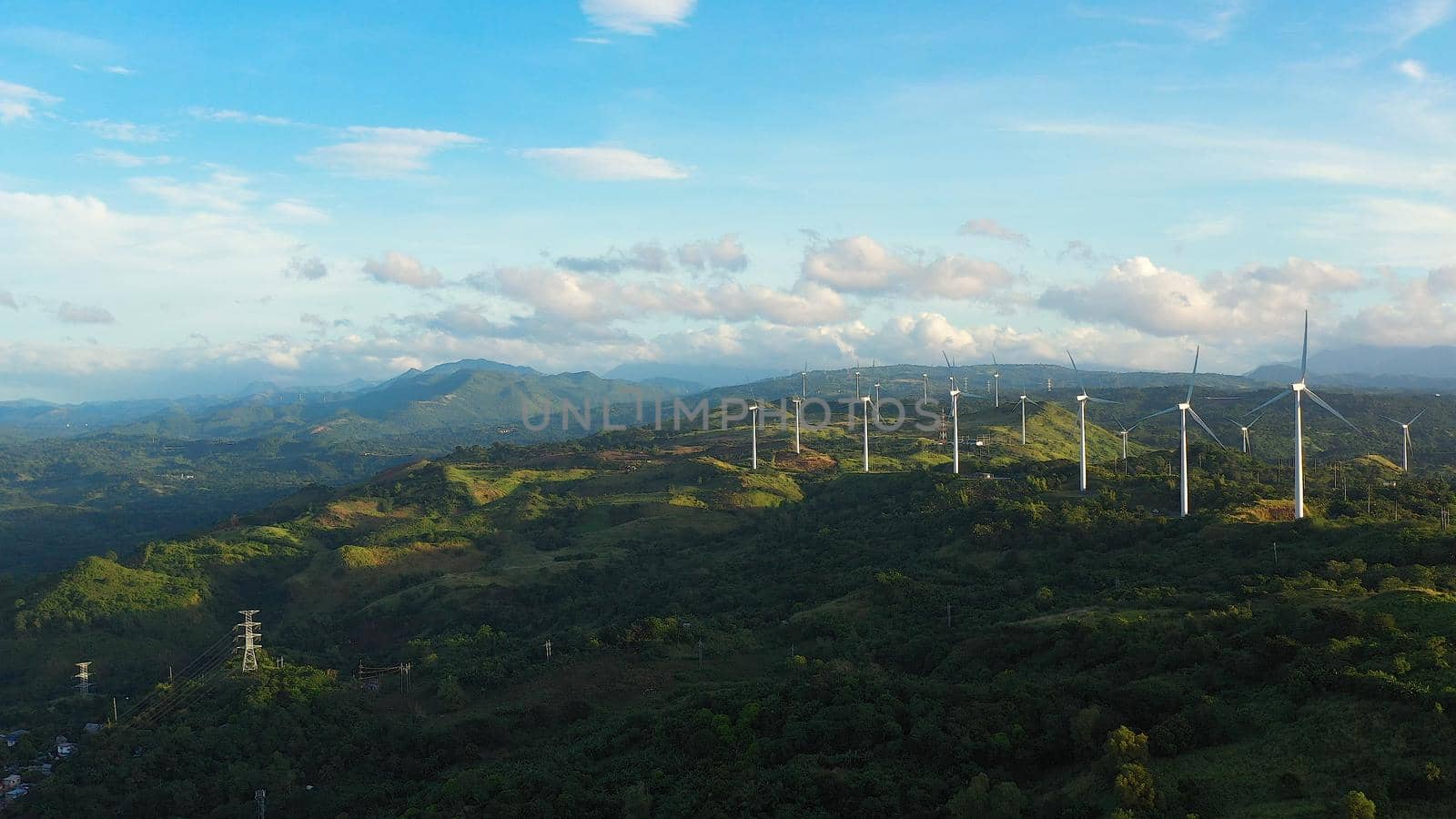 Panorama with Wind turbines generating electricity view from above. Wind mills in the Philippines, Luzon.