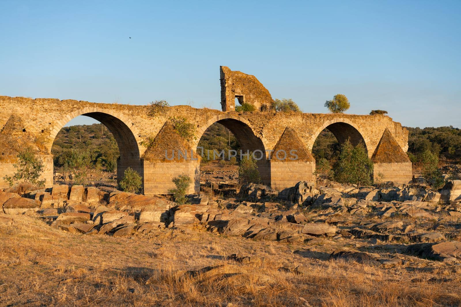 Destroyed abandoned Ajuda bridge crossing the Guadiana river between Spain and Portugal