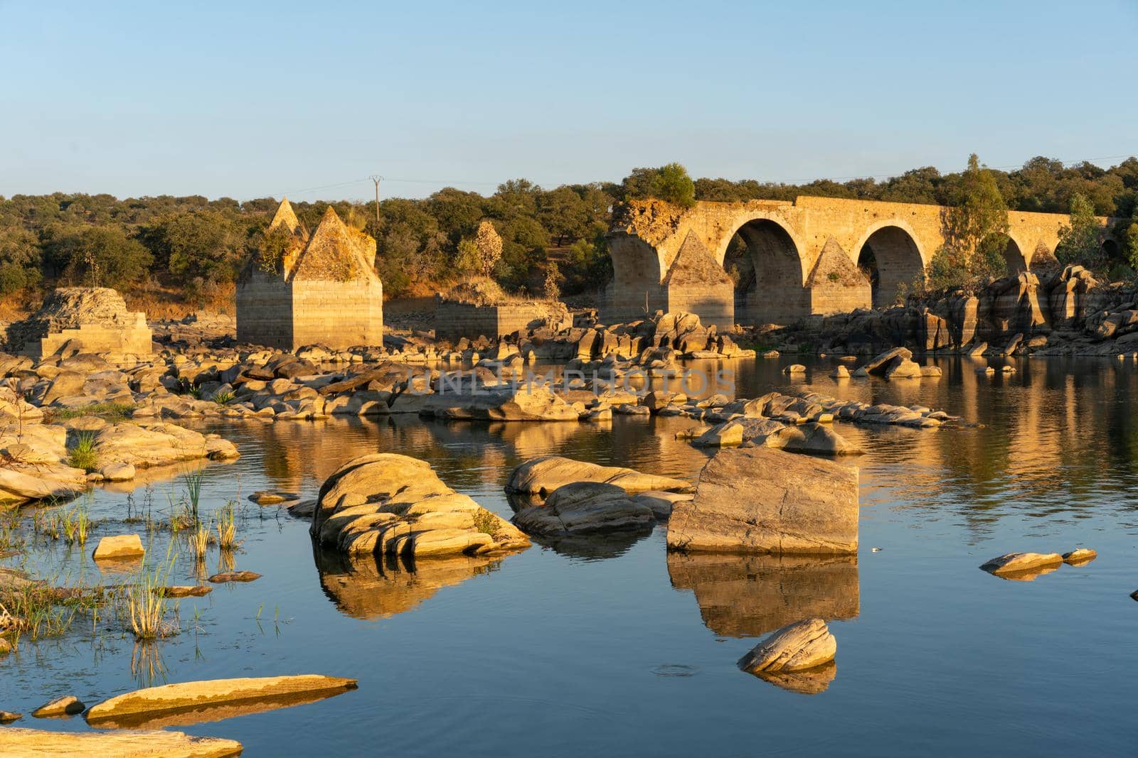 Destroyed abandoned Ajuda bridge crossing the Guadiana river between Spain and Portugal by Luispinaphotography