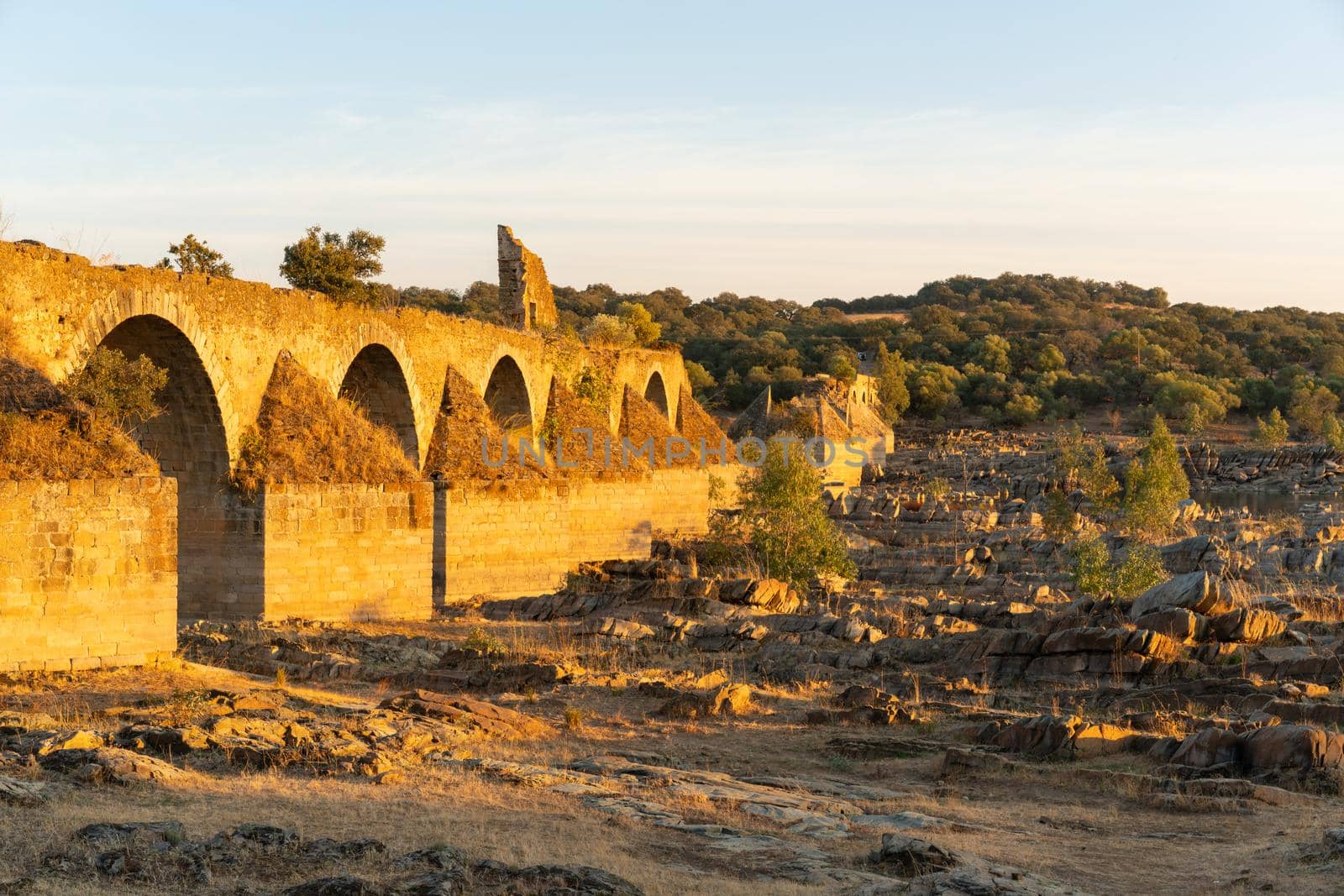 Destroyed abandoned Ajuda bridge crossing the Guadiana river between Spain and Portugal by Luispinaphotography