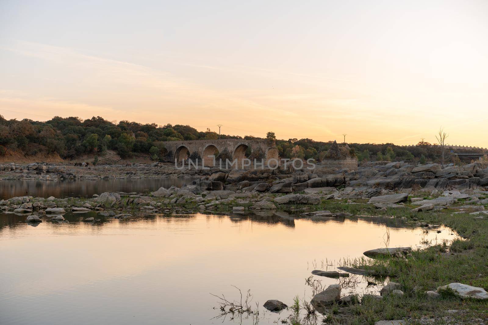 Destroyed abandoned Ajuda bridge crossing the Guadiana river between Spain and Portugal by Luispinaphotography