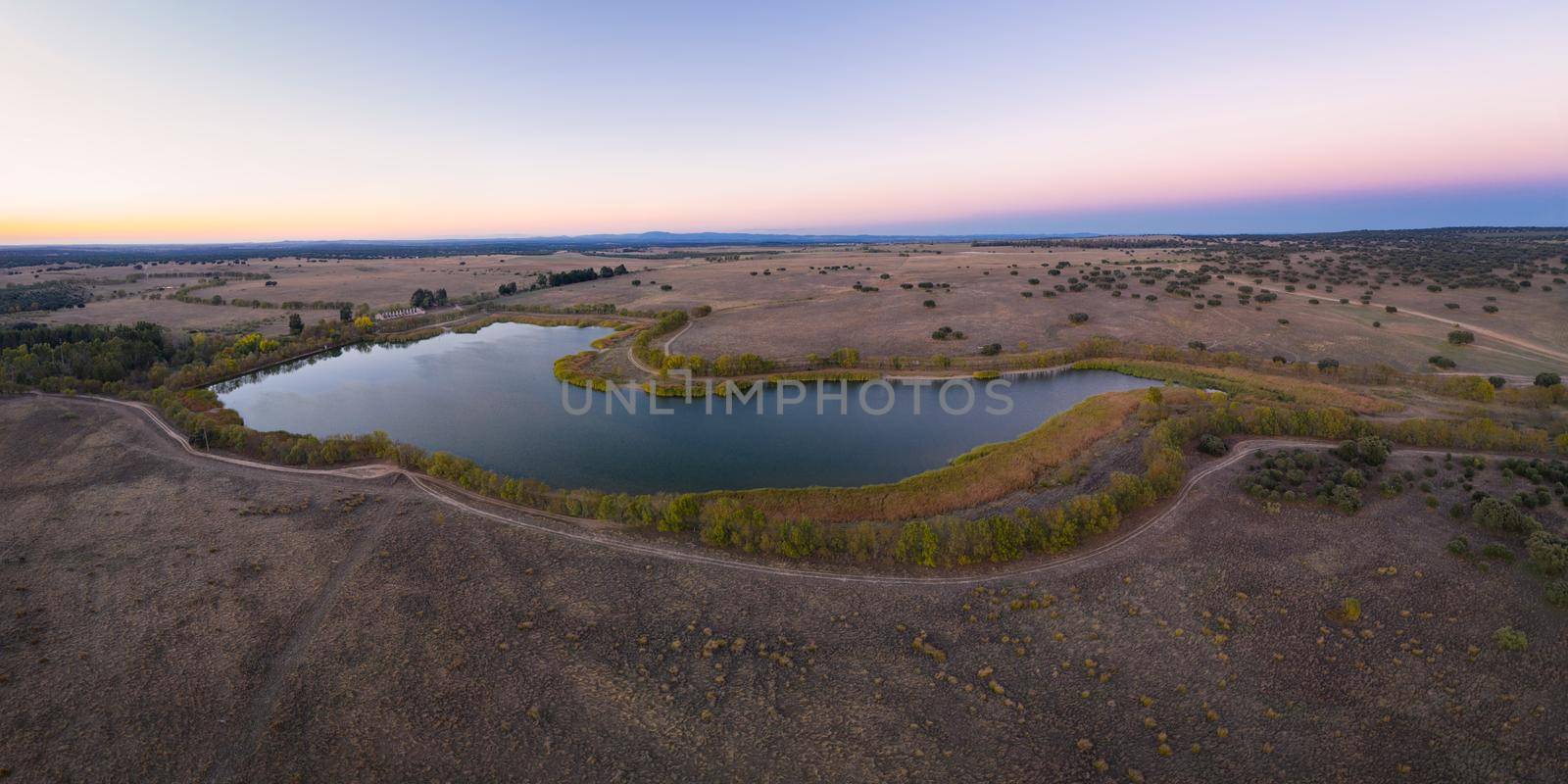 Lake drone aerial view at sunset in Alentejo, Portugal