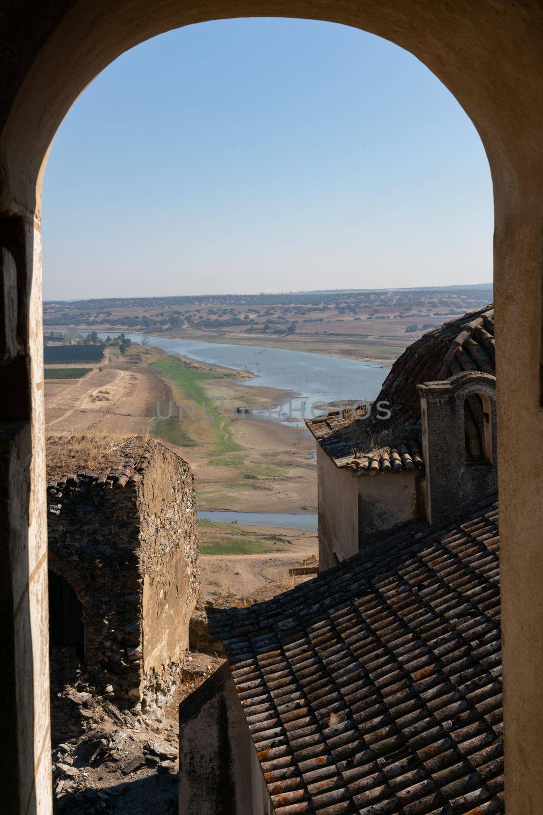 View of Juromenha castle window in Alentejo landscape in Portugal by Luispinaphotography