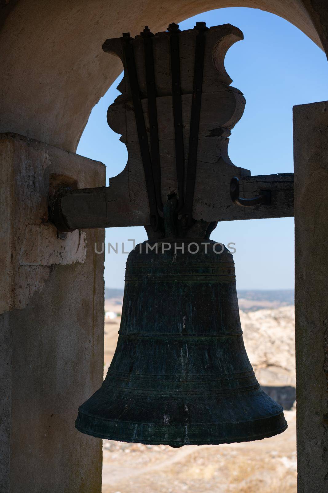 View of Juromenha castle window and bell in Alentejo landscape in Portugal by Luispinaphotography