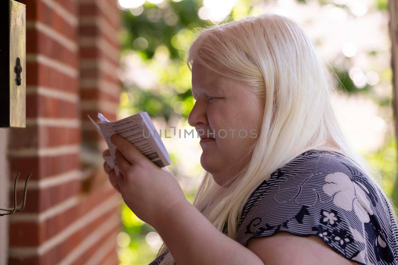 Albino Woman Reading Mail by tornado98