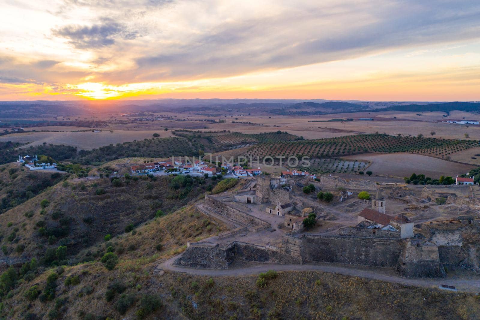 Juromenha castle, village and Guadiana river drone aerial view at sunset in Alentejo, Portugal