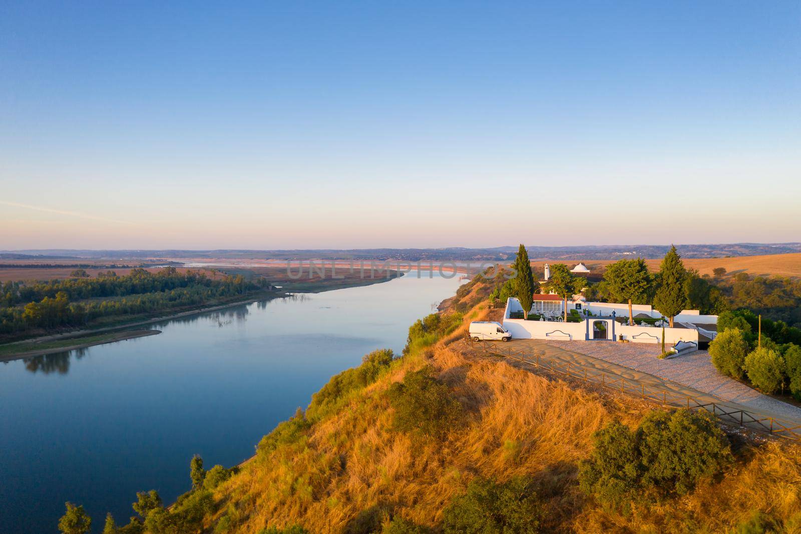 Camper van near Guadiana river drone aerial view in Juromenha Alentejo, Portugal by Luispinaphotography