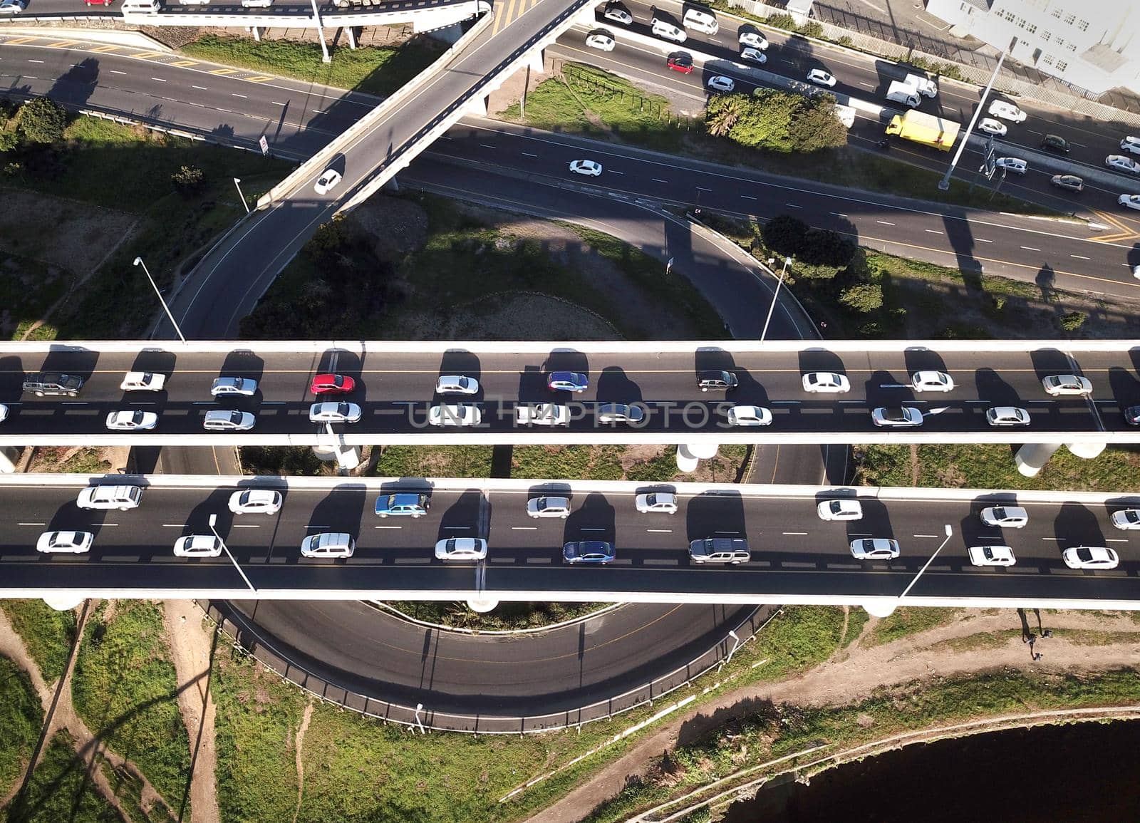 Aerial view over busy interchange at rush hour