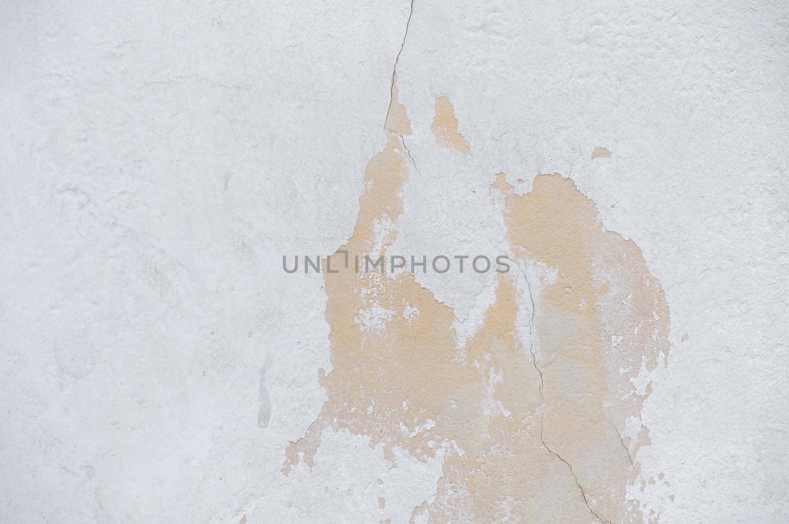 A wall with a peeling surface and roughness close-up.Texture or background