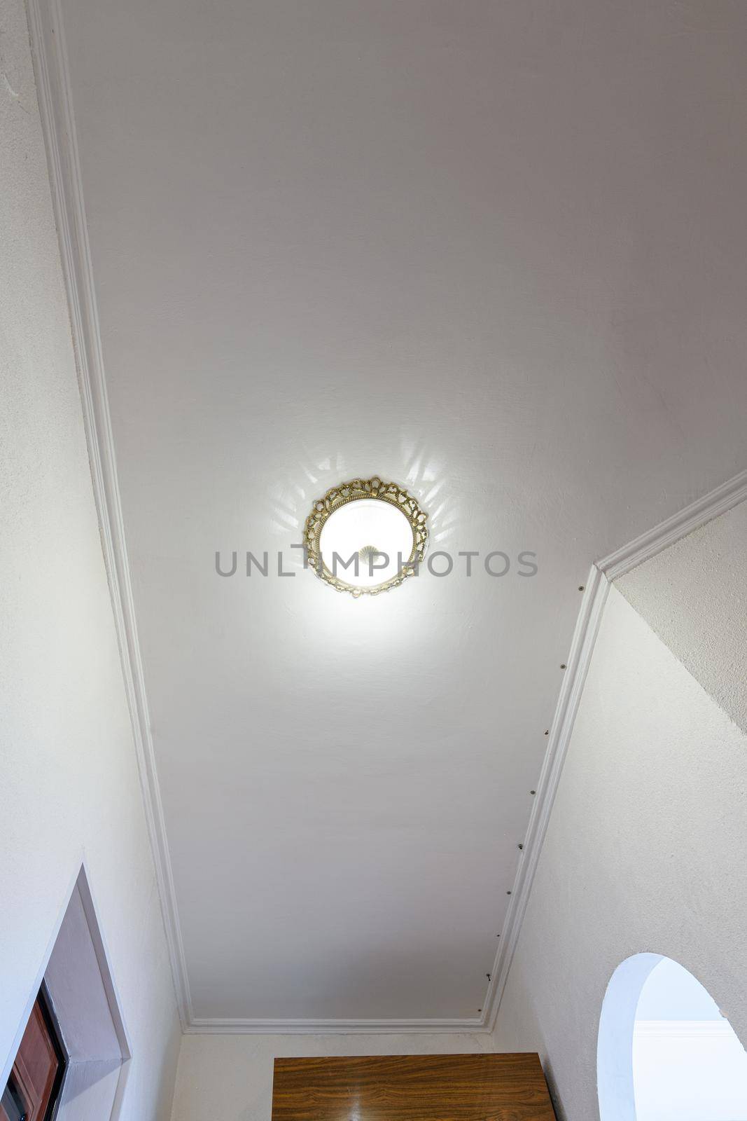 Plastered and white painted ceiling in the hallway