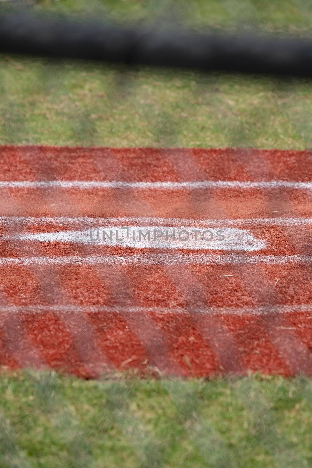 Close up of home plate in an empty baseball field