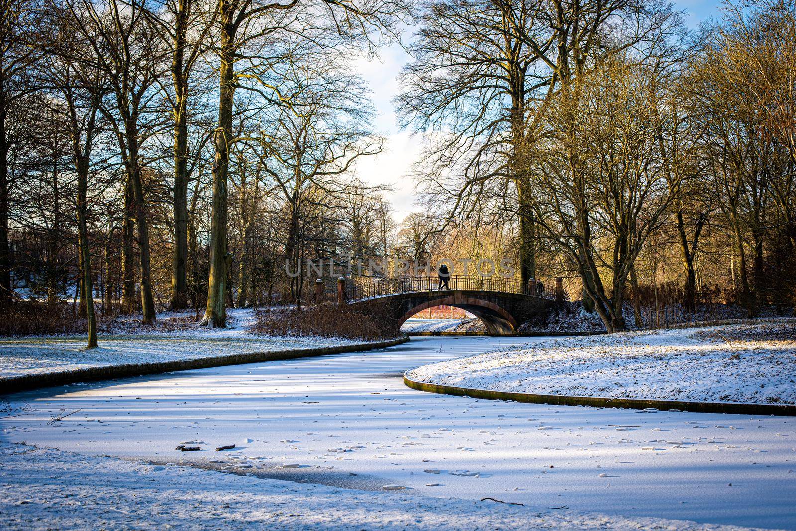 Copenhagen, Denmark - January 31, 2021: People enjoying a snowy winter day in Frederiksberg Gardens.