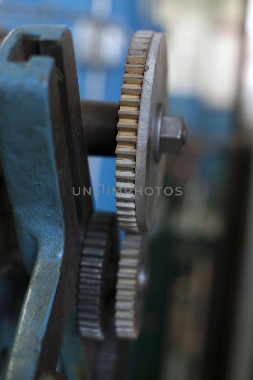 Close up of a set of grinding gears in a metal workshop