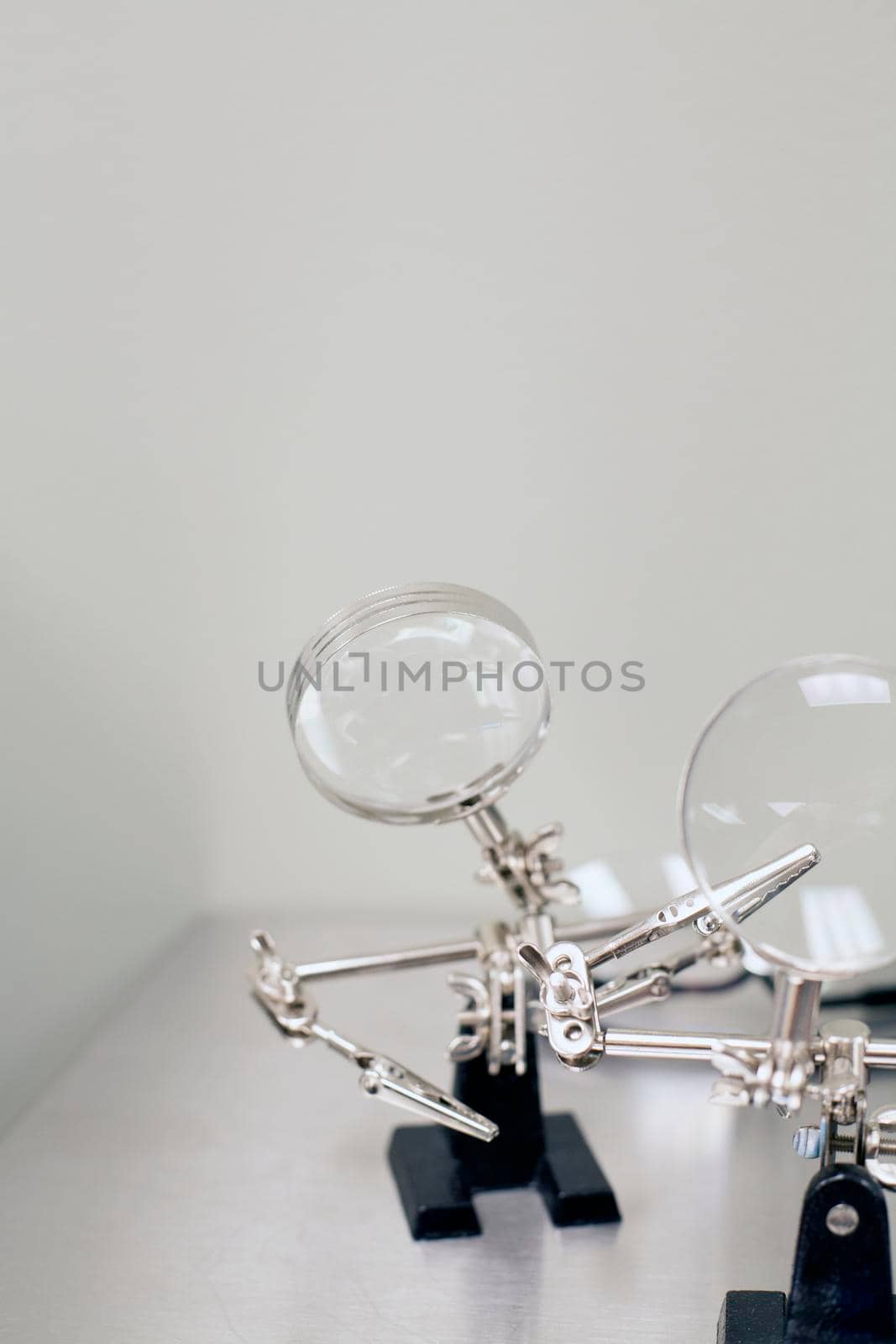 Set of magnifying glasses on a white surface