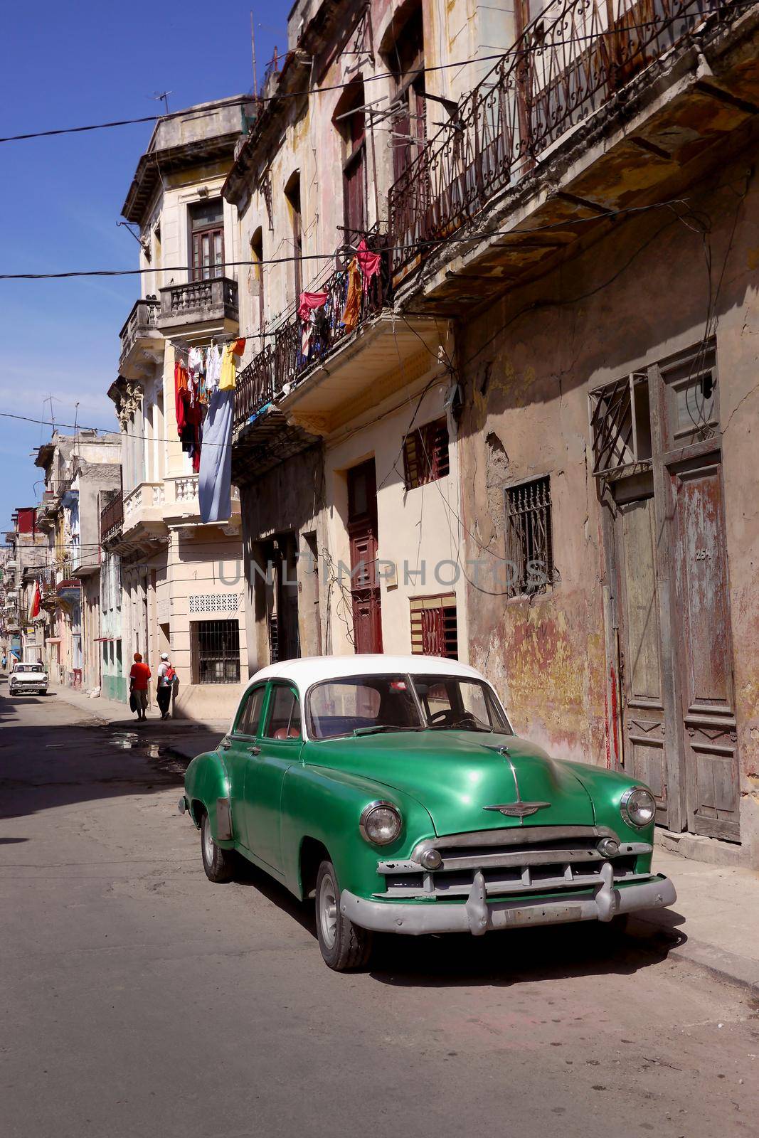 Old car in Havana backstreet, Cuba by fivepointsix