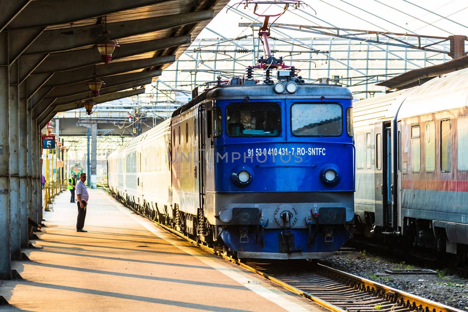 Detail of train in motion at train platform at Bucharest North Railway Station (Gara de Nord Bucharest) in Bucharest, Romania, 2020 by vladispas