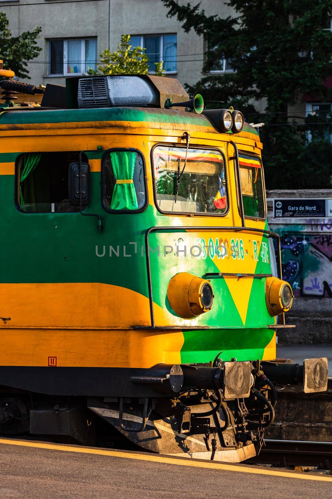 Detail of train in motion at train platform at Bucharest North Railway Station (Gara de Nord Bucharest) in Bucharest, Romania, 2020 by vladispas