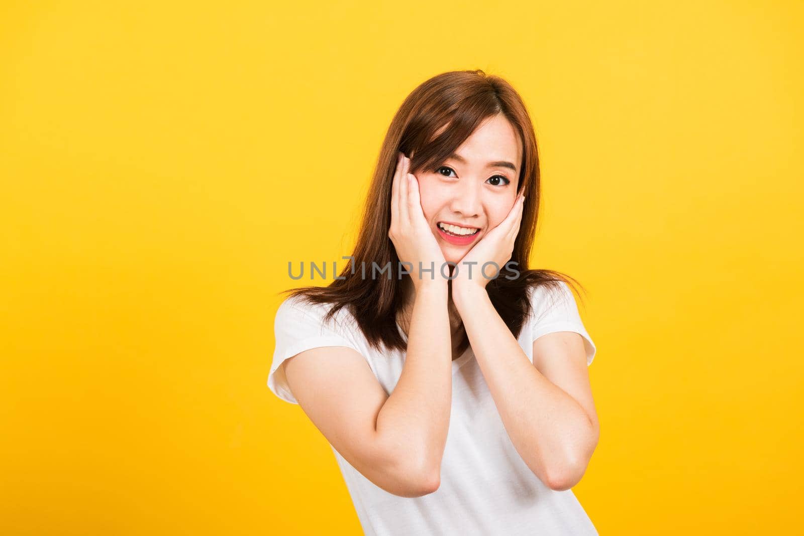 woman teen stand surprised excited celebrating open mouth gesturing palms on face by Sorapop