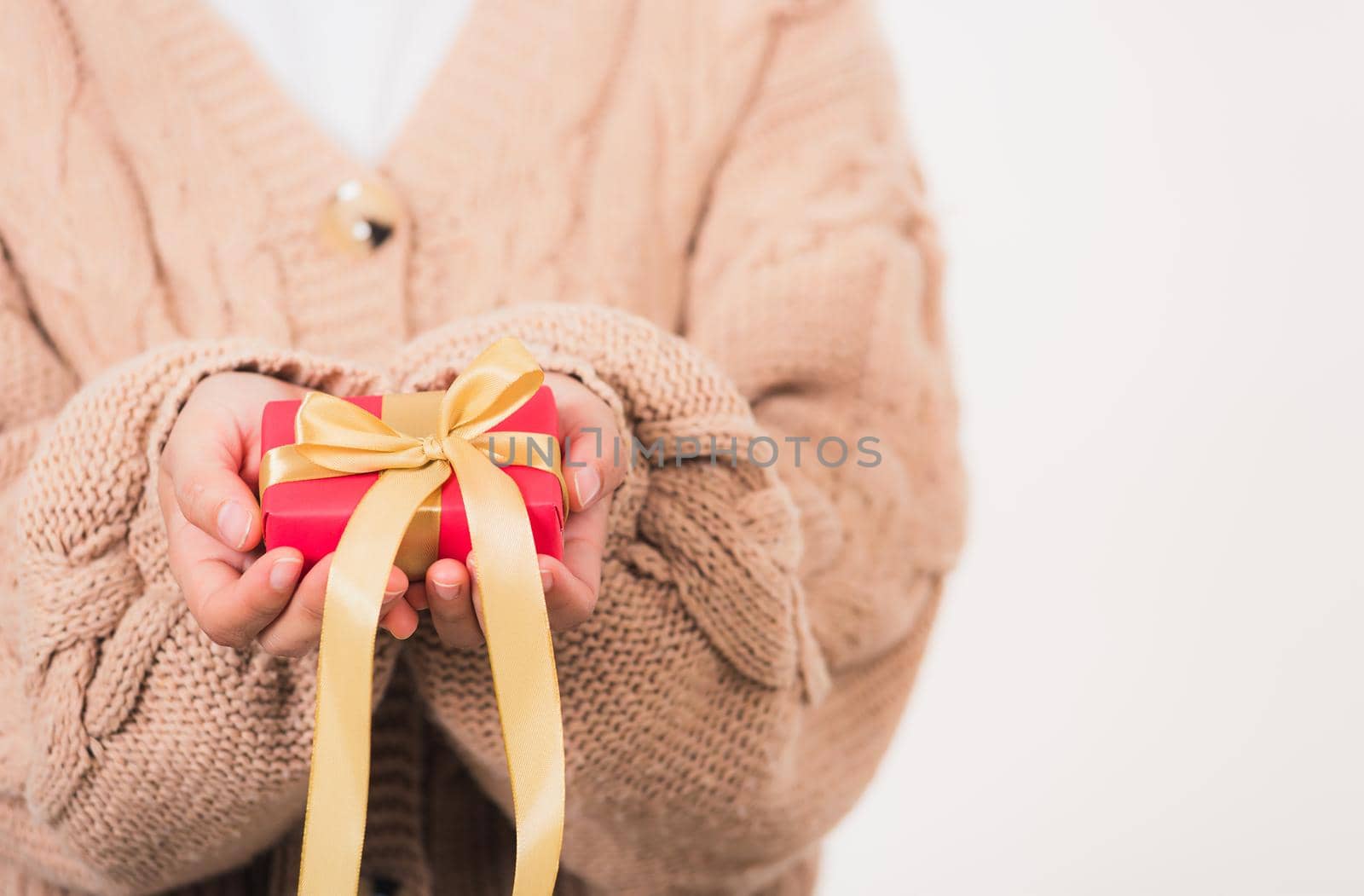 Valentine Day. Woman beauty hands holding small gift package box present wrapped paper with ribbon, Christmas, New year, Birthday holiday background concept