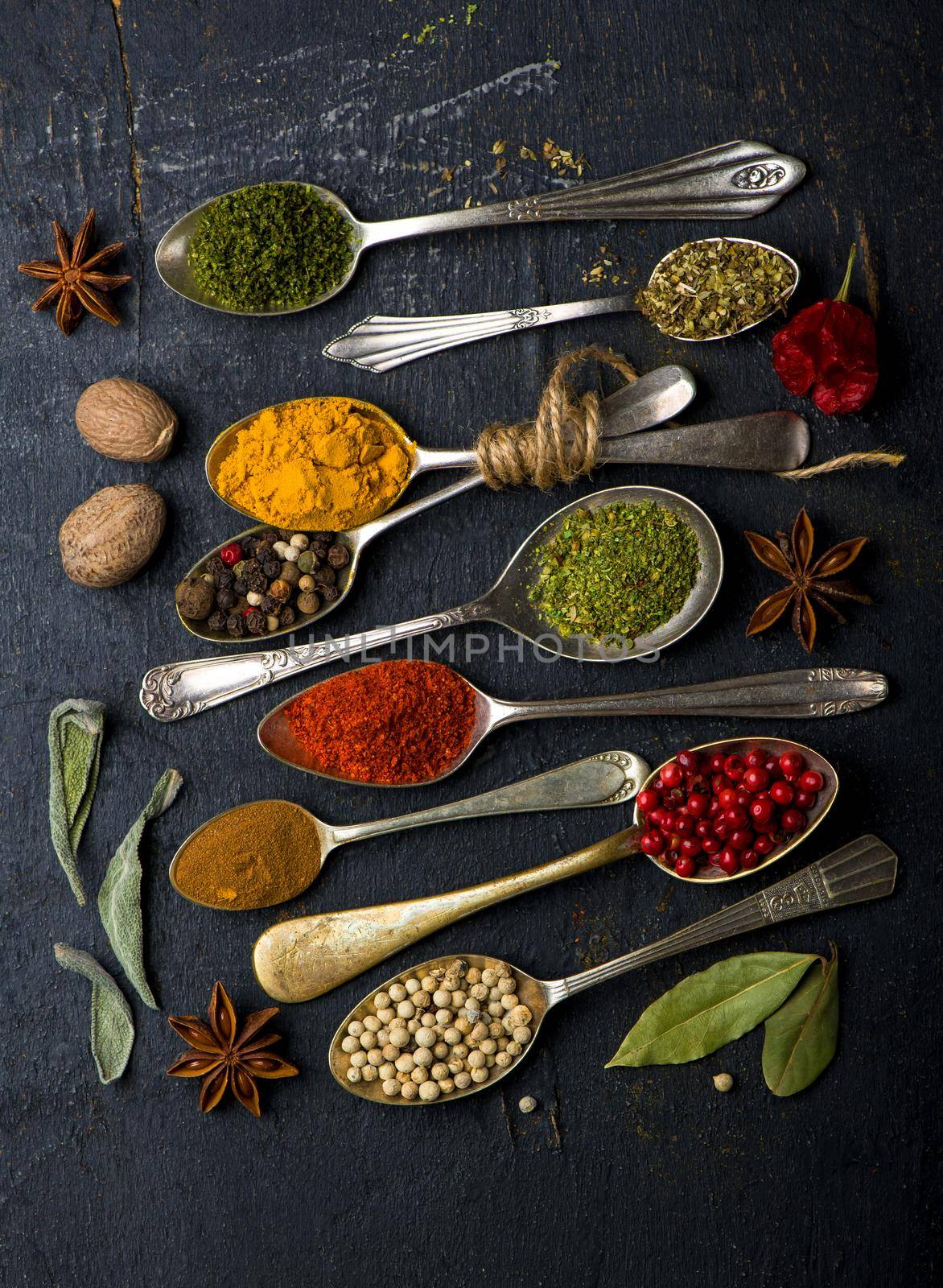 Various spices spoons on table. Top view with copy space