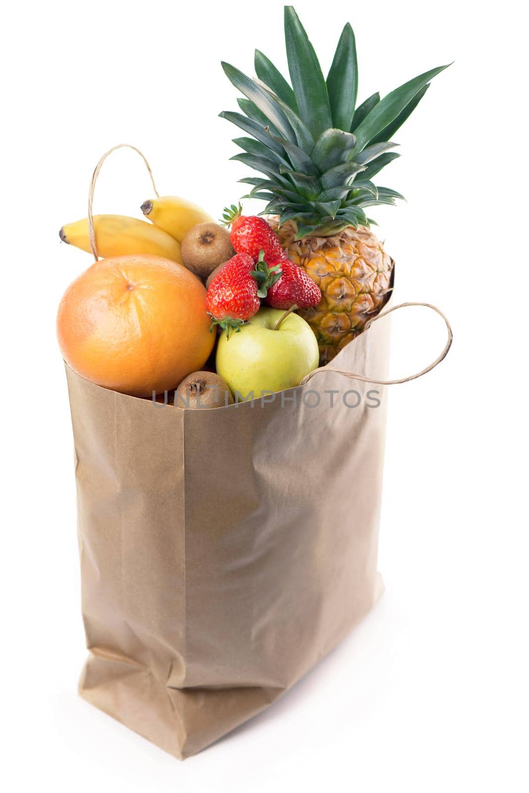 Fruits and vegetables in paper grocery bag isolated over white by aprilphoto