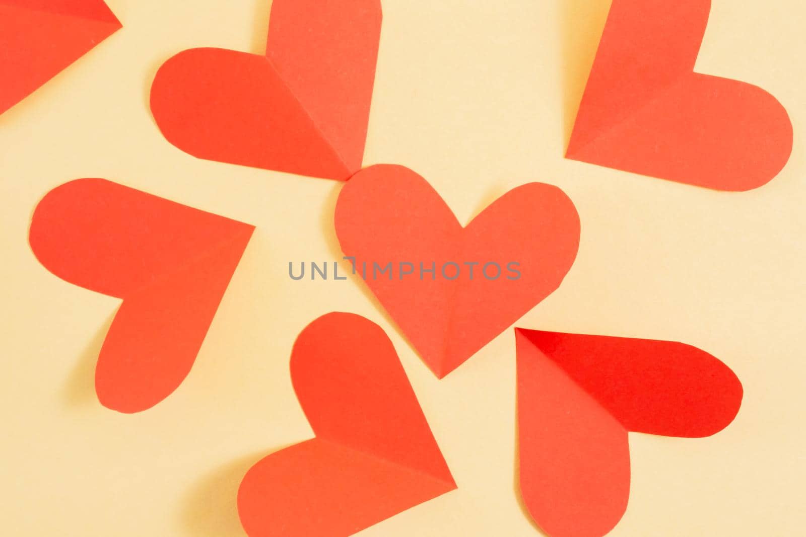 Valentine's day background. red hearts on a yellow background. Valentine's day concept. Layout for postcards and congratulations. Flat lay, top view, copy space