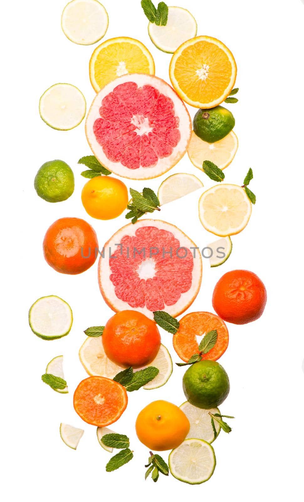 Citrus background. Fresh citrus fruits - Lemons, oranges, limes, grapefruits on the white background by aprilphoto