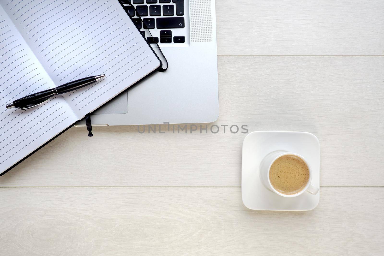 Coffee and notepad with computer by fivepointsix