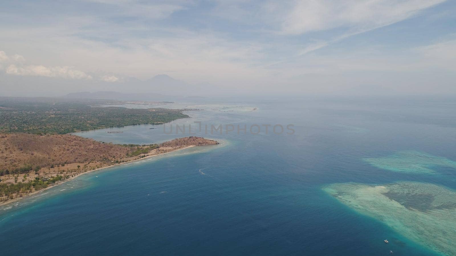 sea coast with tropical beach. aerial seascape tropical landscape, sea, boats on the surface water. Bali,Indonesia, travel concept.