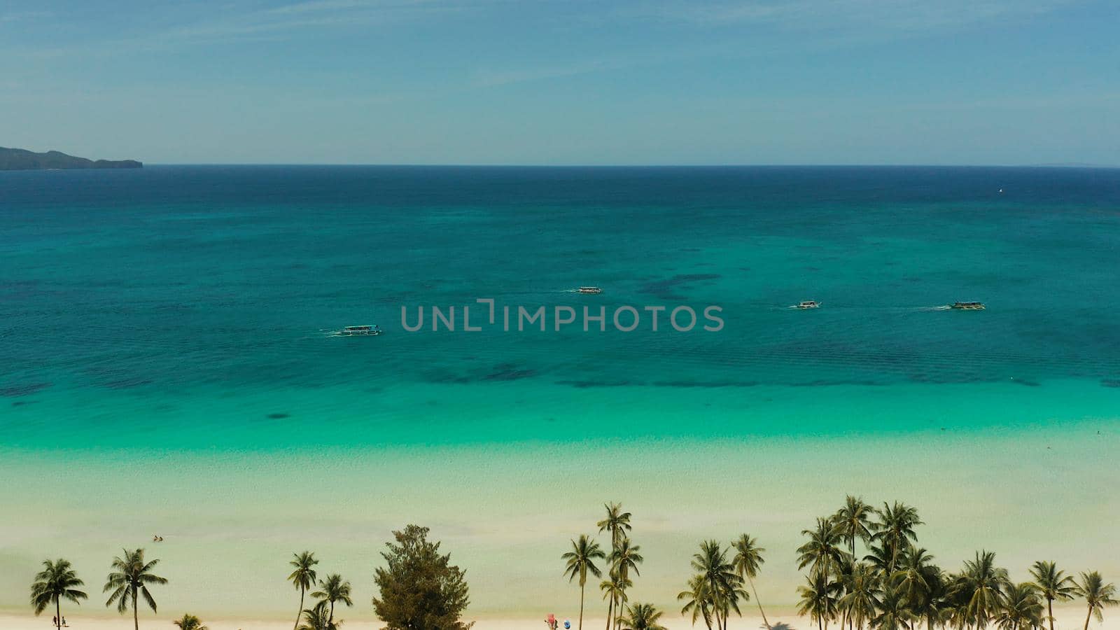 Tropical sandy beach with wave and turquoise water,copy space for text, aerial view. Ocean with waves and tropical beach. Summer and travel vacation concept