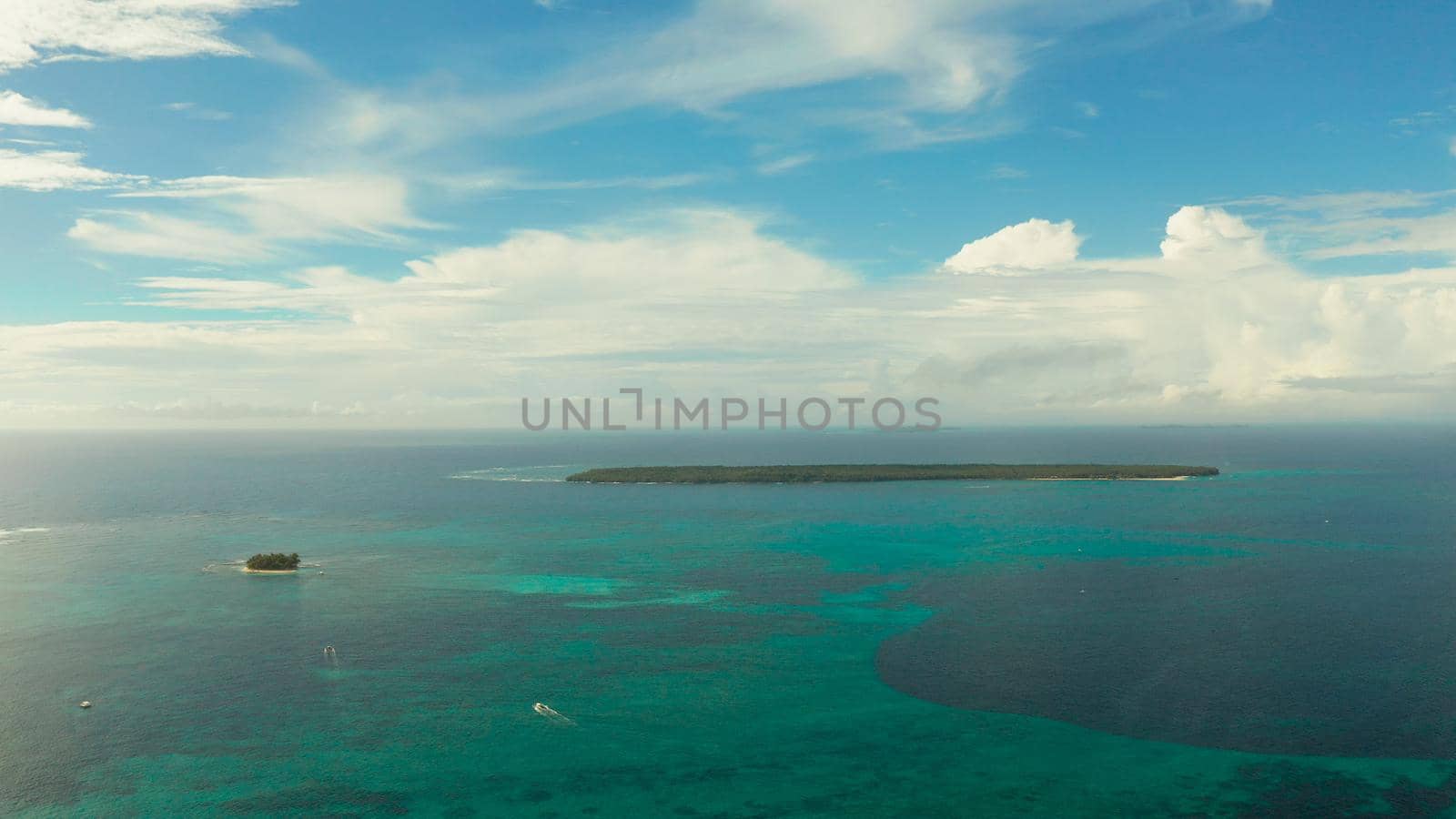 Tropical islands in turquoise lagoon and coral reef water, aerial view. Summer and travel vacation concept. Siargao,Philippines.