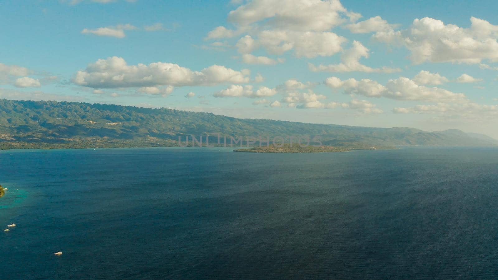 Blue sky with clouds over the sea and islands, aerial view. Seascape: Ocean and sky Cebu, Philippines.