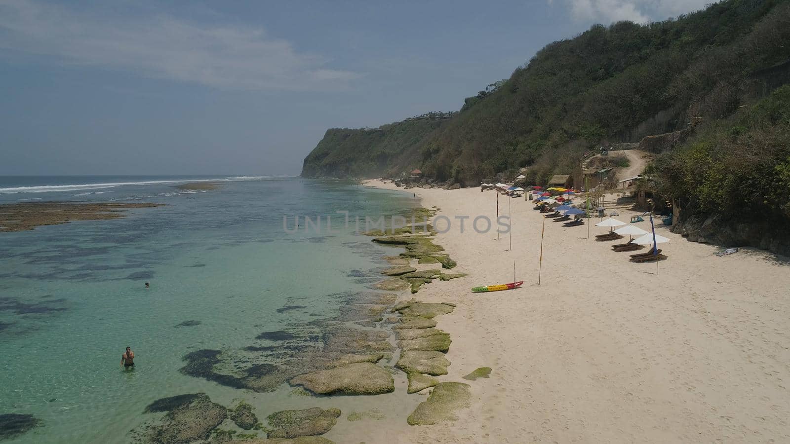 Aerial view coast with sandy tropical beach. seascape ocean surf and tropical beach large waves turquoise water crushing on beach Melasti, Bali,Indonesia. Travel concept.