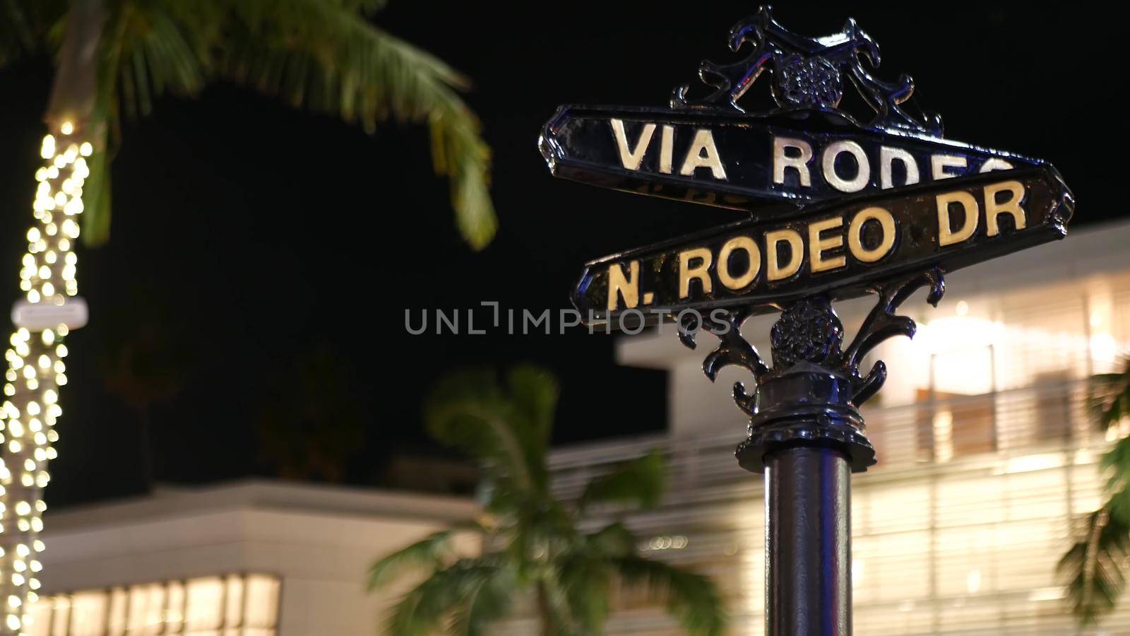 World famous Rodeo Drive symbol, Cross Street Sign, Intersection in Beverly Hills. Touristic Los Angeles, California, USA. Rich wealthy life consumerism, Luxury brands and high-class stores concept