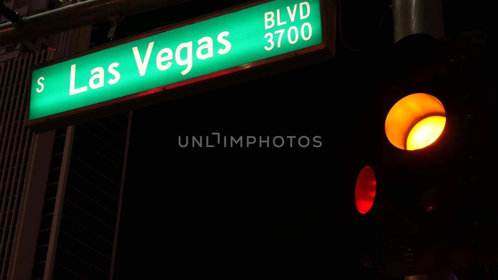 Fabulos Las Vegas, traffic sign glowing on The Strip in sin city of USA. Iconic signboard on the road to Fremont street in Nevada. Illuminated symbol of casino money playing and bets in gaming area by DogoraSun
