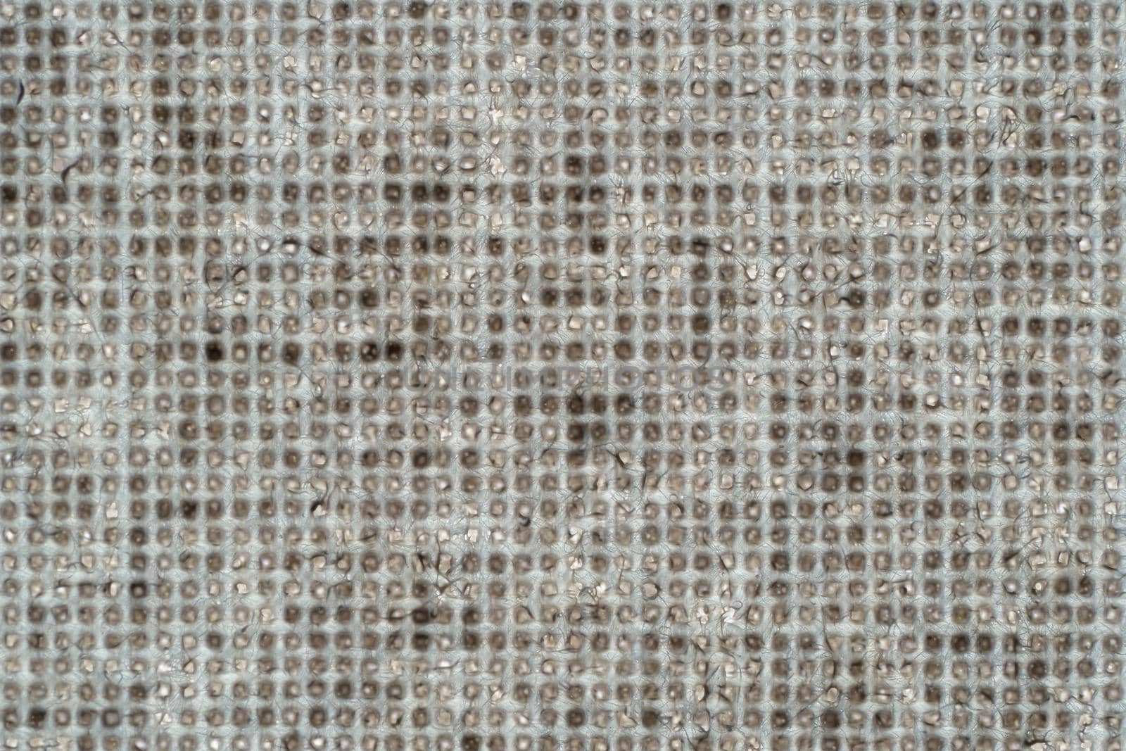 Macro shot of fine brown beige fabric in a square shape