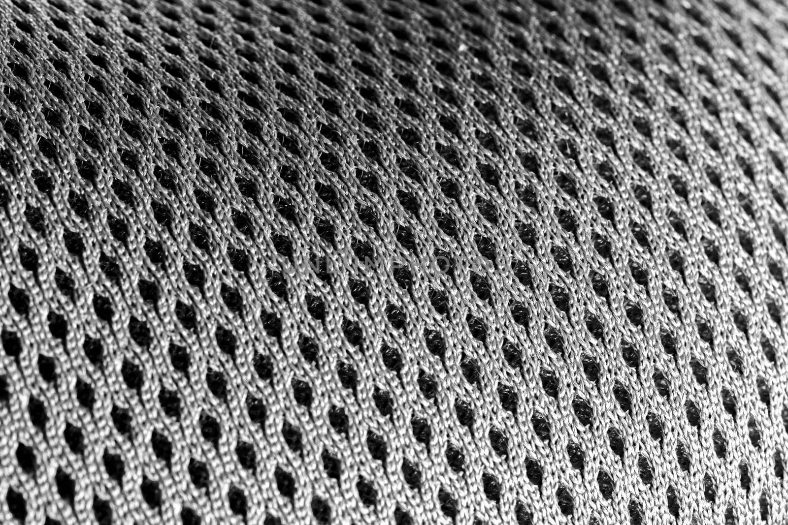 Macro shot of a mesh-like undulating gray silver surface by silent303