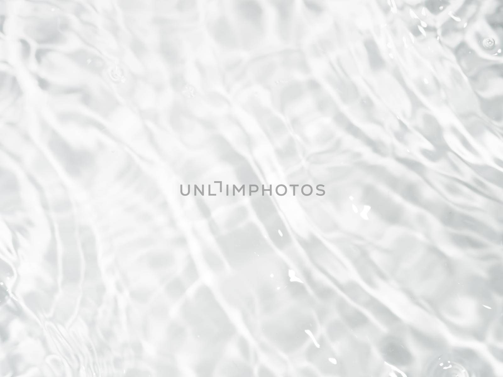Ripple water texture on white background. Shadow of water on sunlight. Mockup for product, spa or travel background. Marble blue water surface as wallpaper background