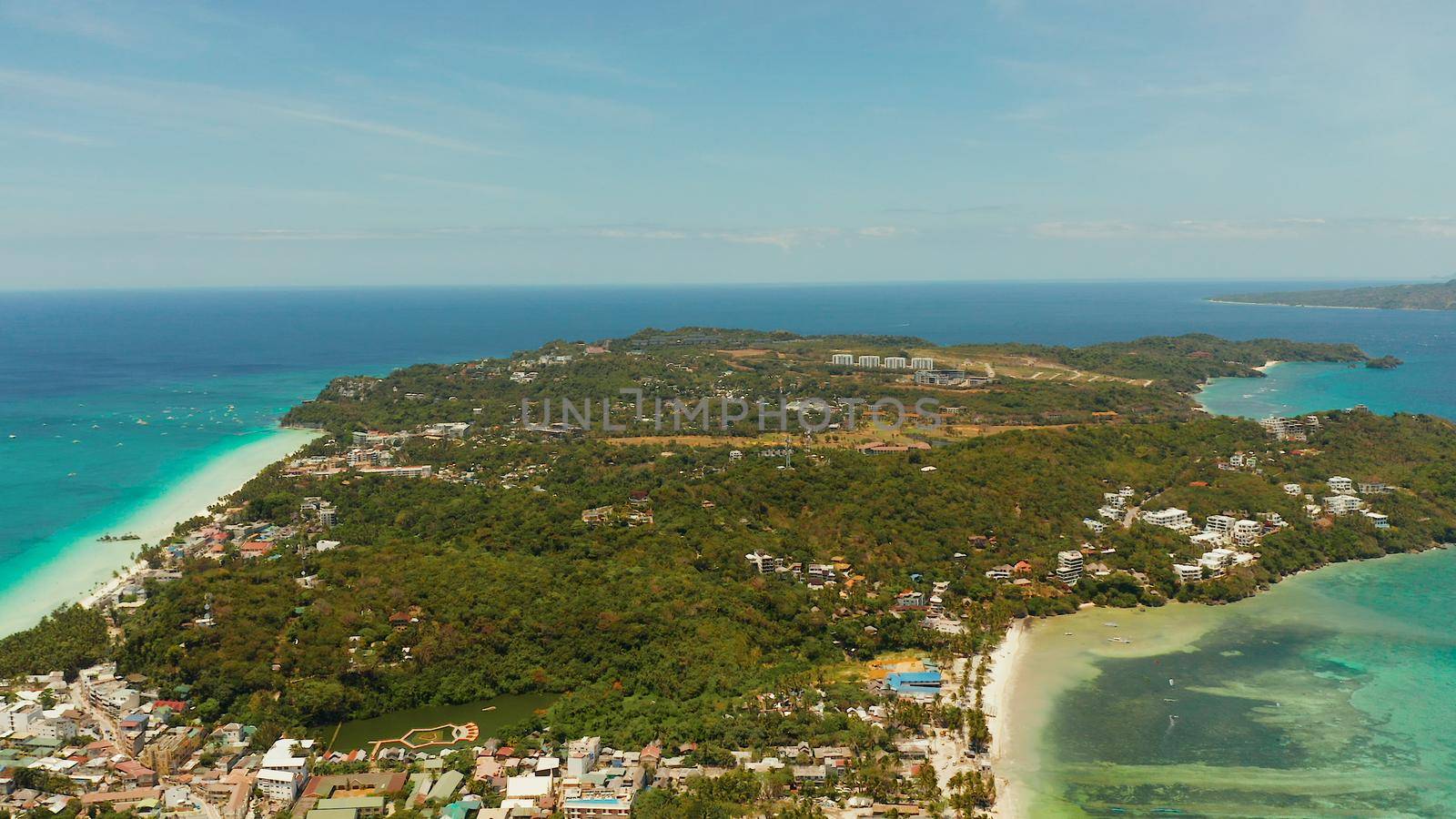 Costline of the tropical island of Boracay with sandy beaches and hotels from above. Summer and travel vacation concept. Philippines.