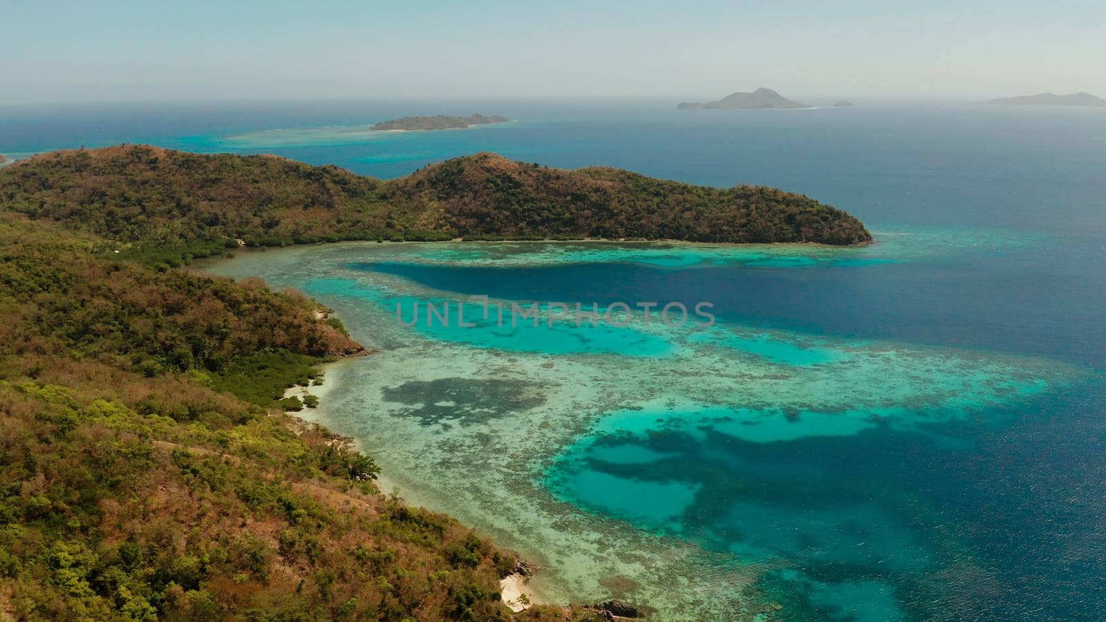 aerial seascape tropical beach with white sand and clear blue sea. tropical landscape with islands and beaches. Philippines, Palawan.