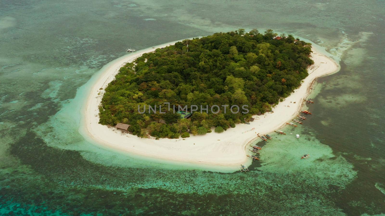 Beautiful beach on tropical island surrounded by coral reef, top view. Mantigue island. Small island with sandy beach. Summer and travel vacation concept, Camiguin, Philippines, Mindanao