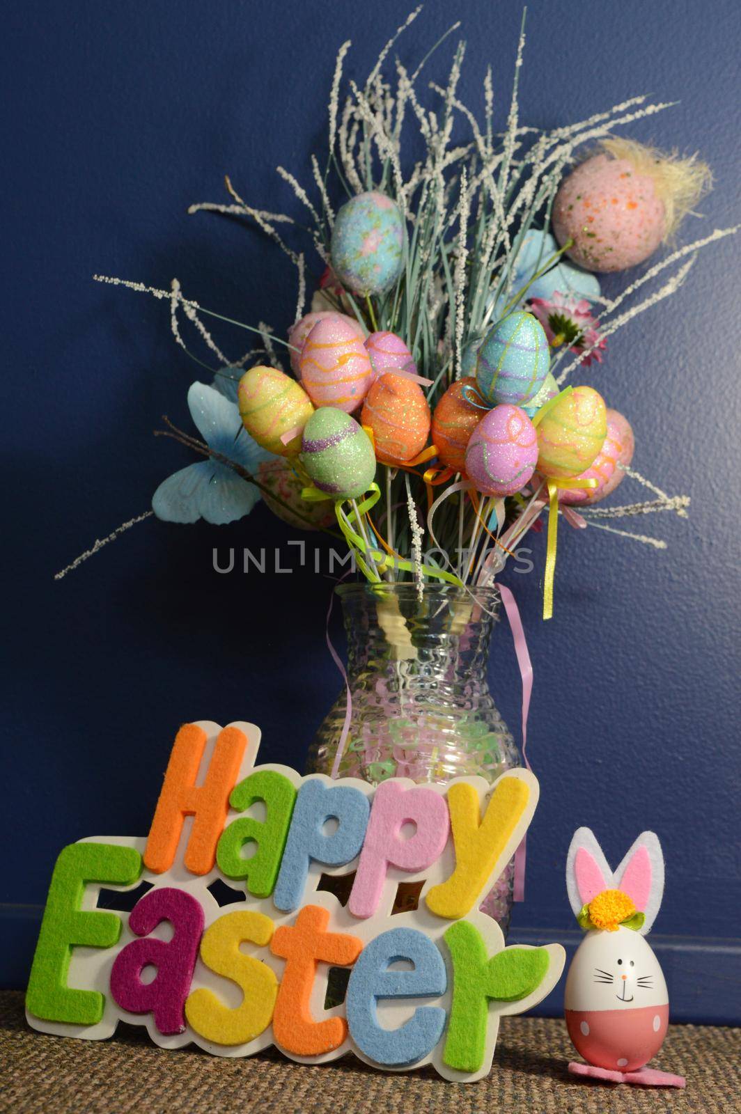 A greeting saying Happy Easter with a bouquet of egg decor for the festive holiday season.