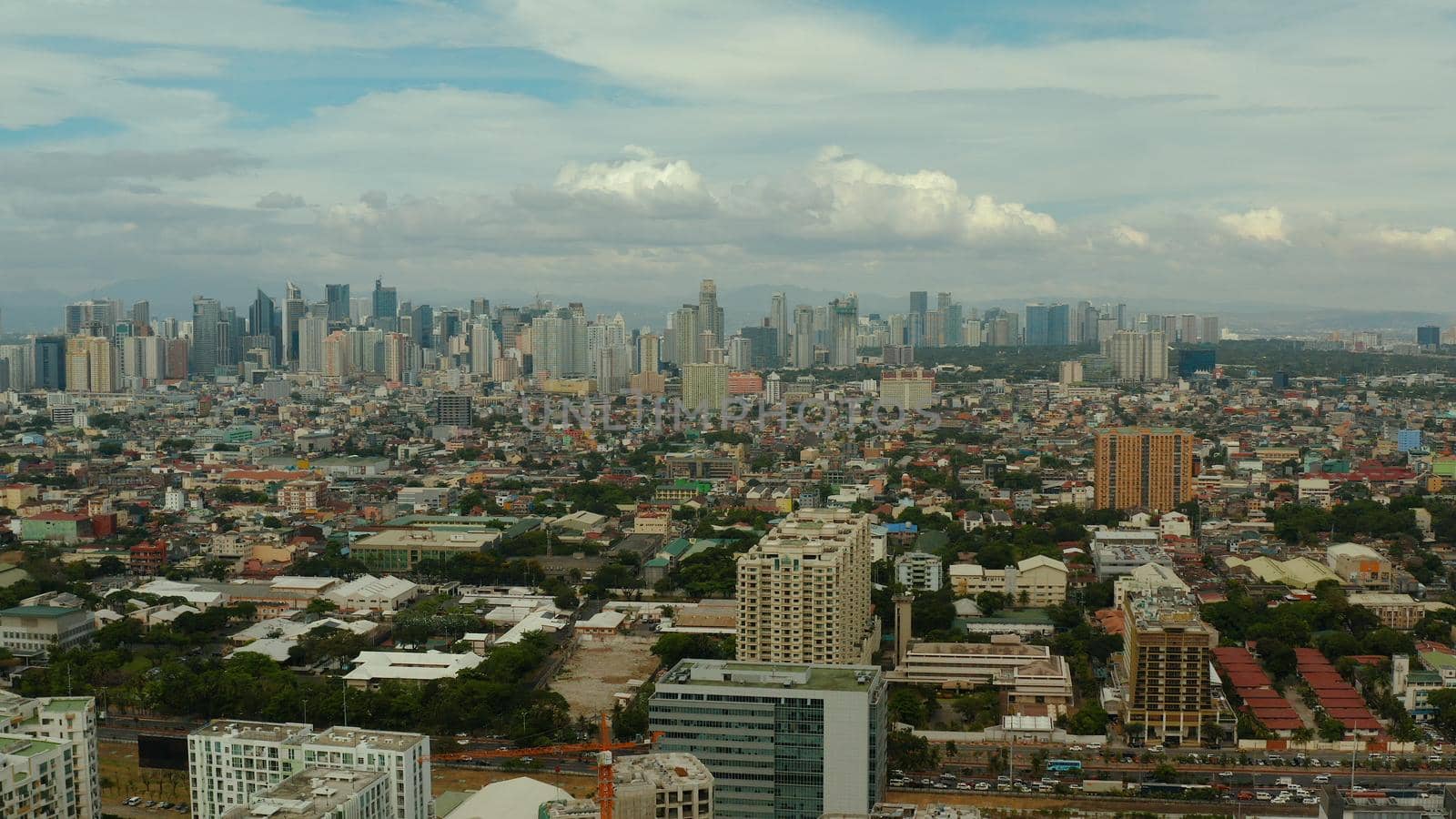 Populous city of Manila, the capital of the Philippines with skyscrapers, streets and buildings. Travel vacation concept.