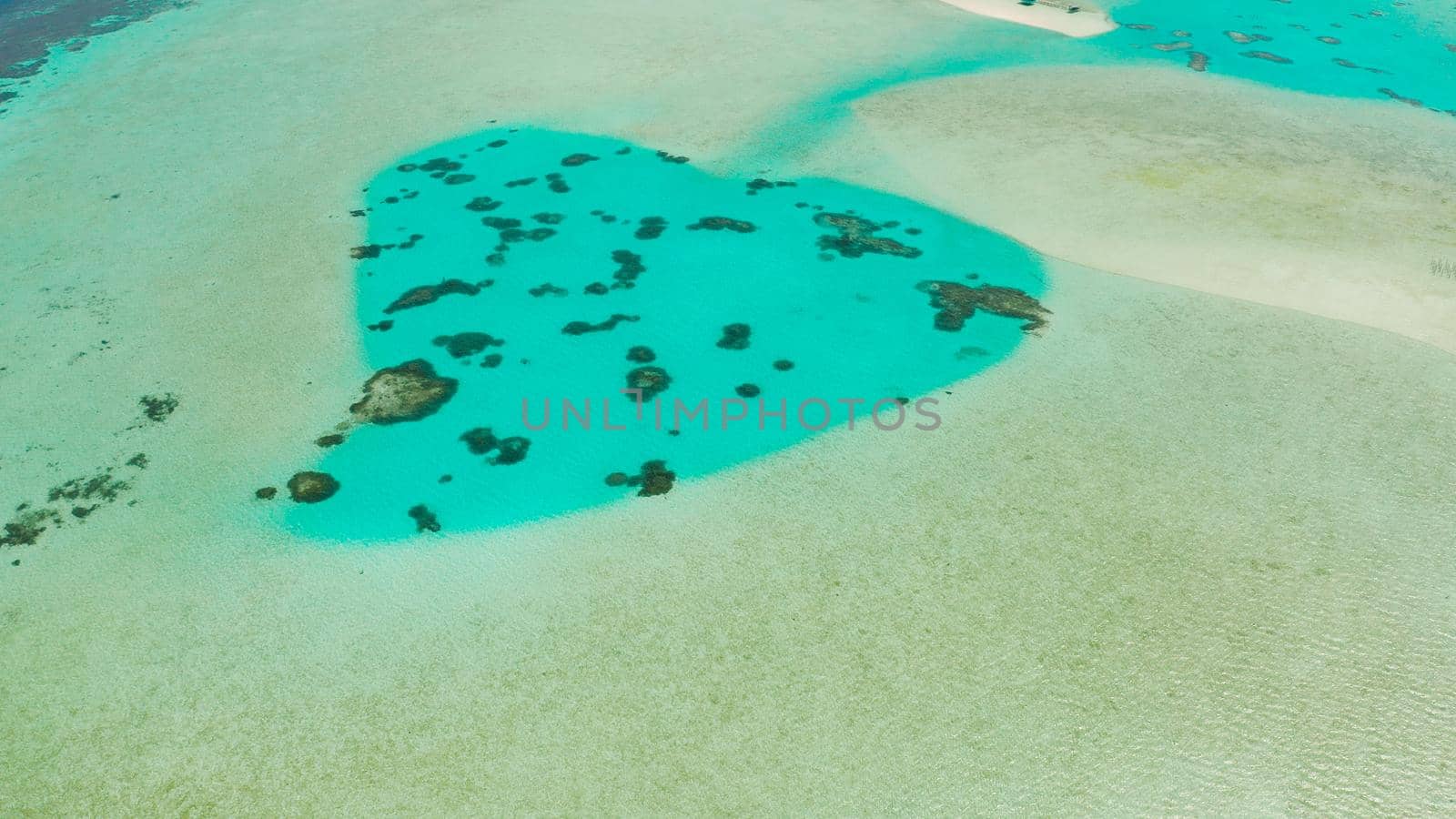 Turquoise lagoon surface on atoll and coral reef, copy space for text. Top view transparent turquoise ocean water surface. background texture